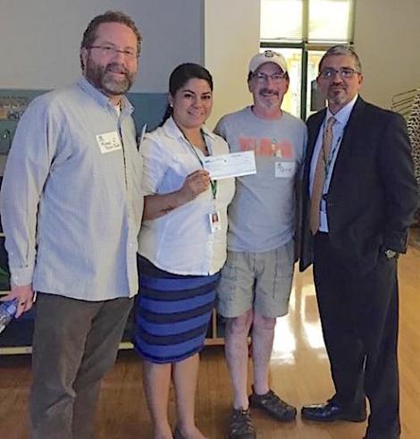(Michael Taylor-Judd, Delridge Community Center Coordinator Angie Ramirez, Pete Spalding, and Parks Superintendent Jesus Aguirre, left to right.)